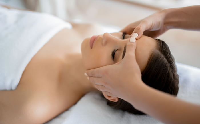 woman getting a facial massage for rest and relaxation